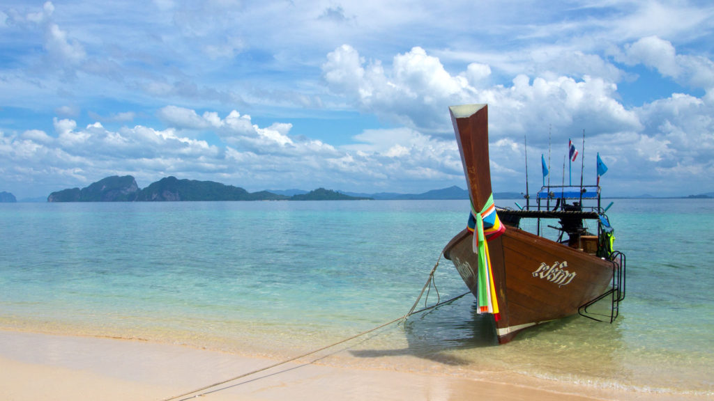 A longtail boat at the Paradise Beach of Koh Kradan