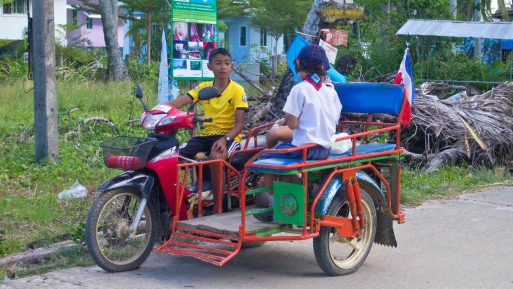 A child as a taxi driver on Koh Mook, Trang