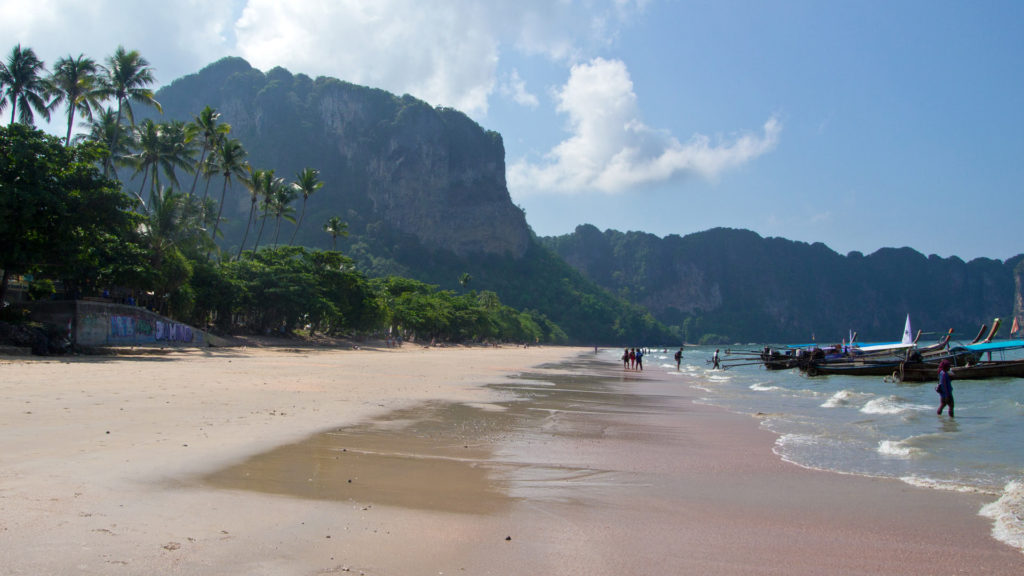 The Ao Nang Beach with a view at the huge limestone cliffs of Ao Nang, Krabi