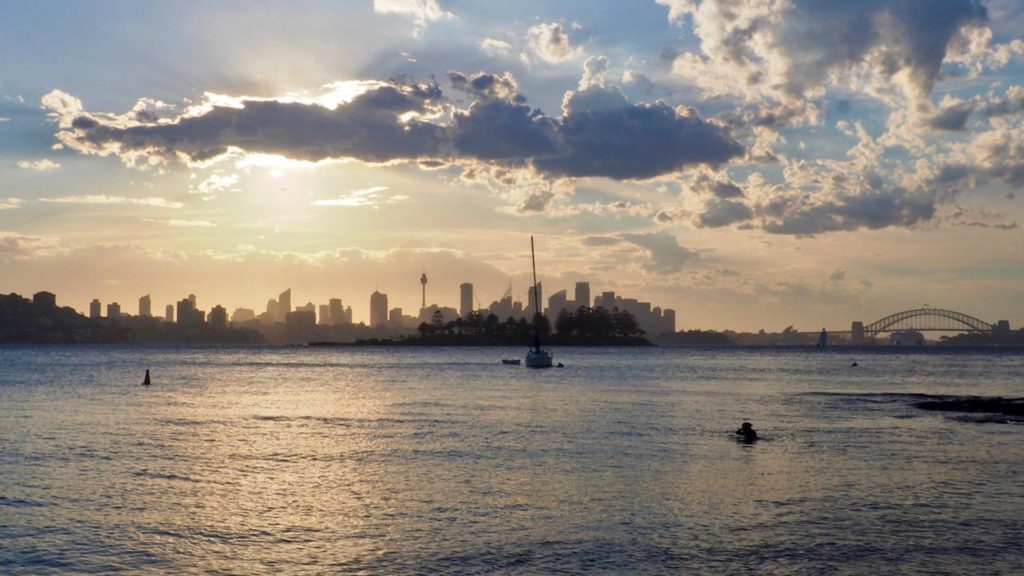 Sunset at Milk Beach with a view of the Sydney skyline