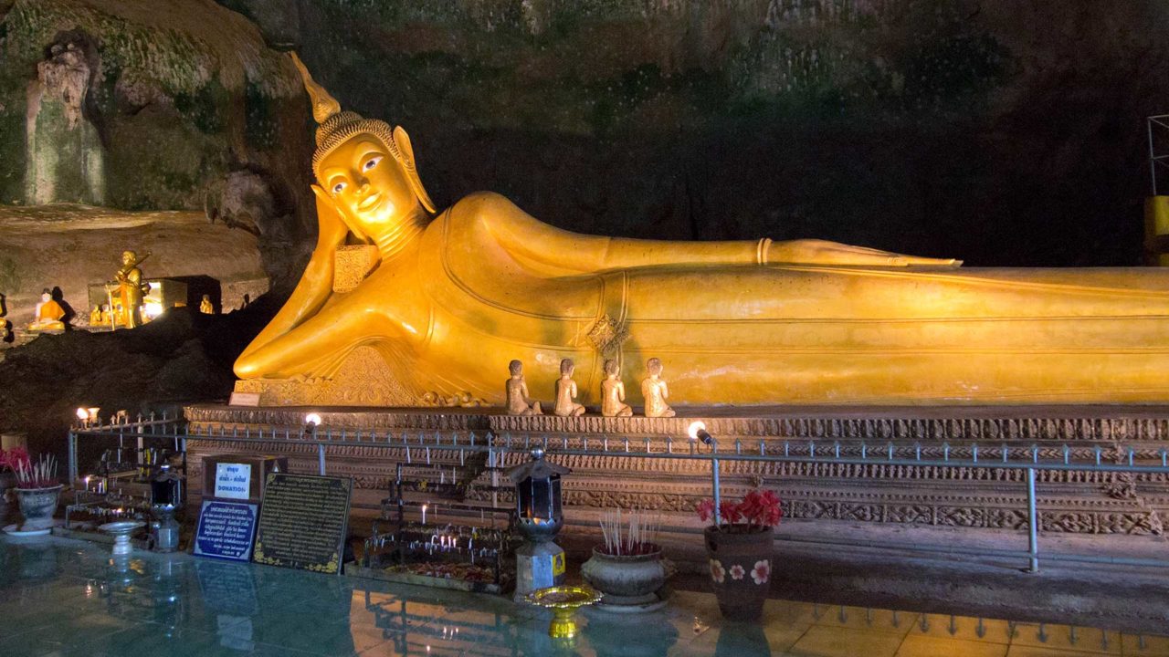 Golden Buddha in Wat Suwan Kuha Cave Temple