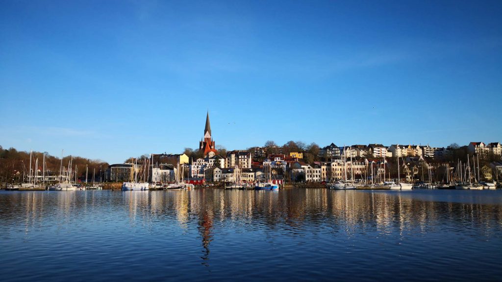 View of the harbor and the east side of Flensburg with the St. Jürgen Church