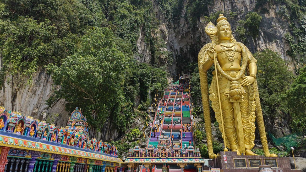 The statue of the god Murugan in front of the Batu Caves entrance