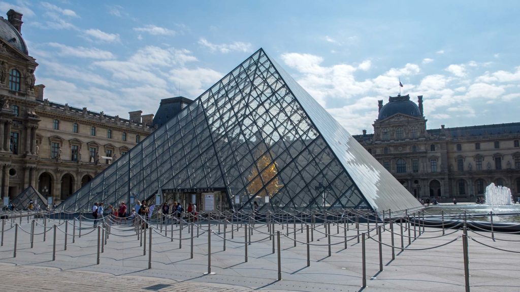The famous glass pyramid of the Louvre in Paris