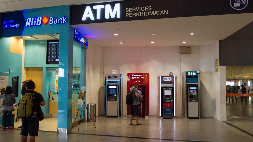 Travel expenses planning: Currency exchange office and ATMs at KLIA2 Airport in Kuala Lumpur, Malaysia
