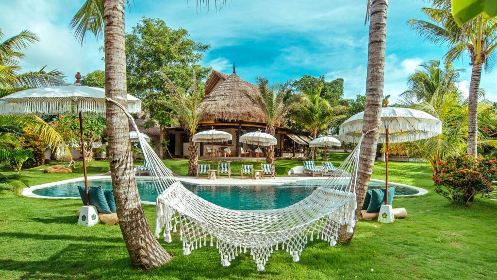 Garden with swimming pool in the Mule Malu Tropical Stay on Bali