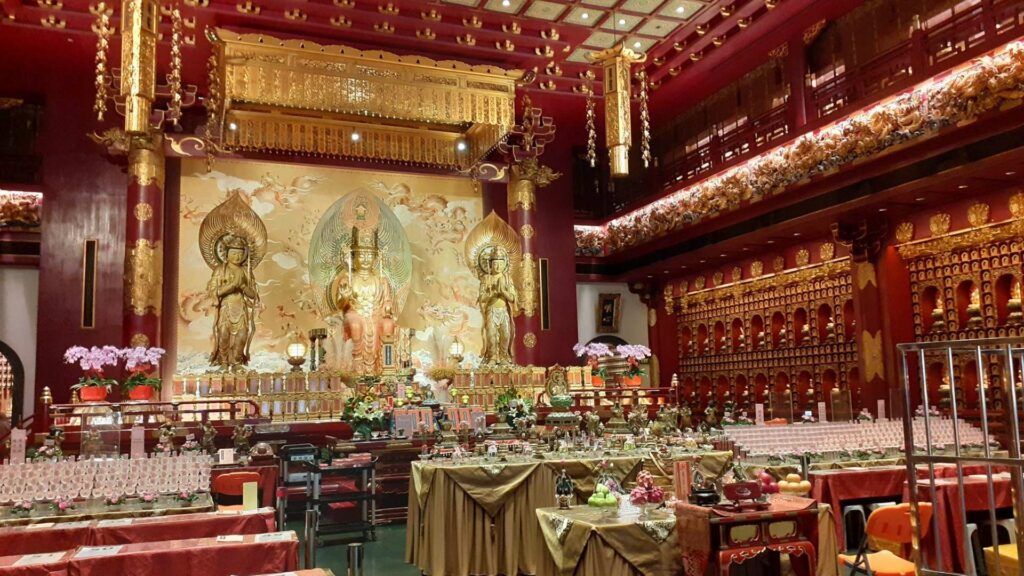 The Buddha Tooth Relic Temple in Singapore from inside with golden Buddha statues