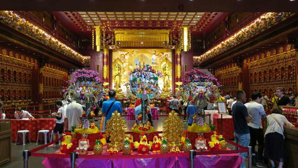 The Buddha Tooth Relic Temple in Singapore from inside with golden Buddha statues