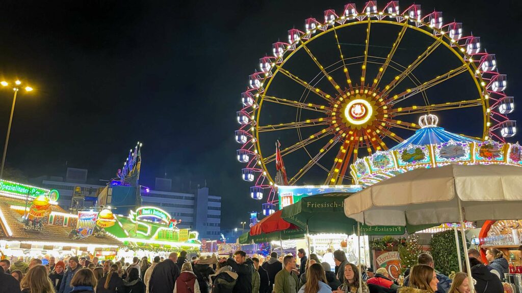 Ferris wheel and stands on the Hamburger Dom in St. Pauli